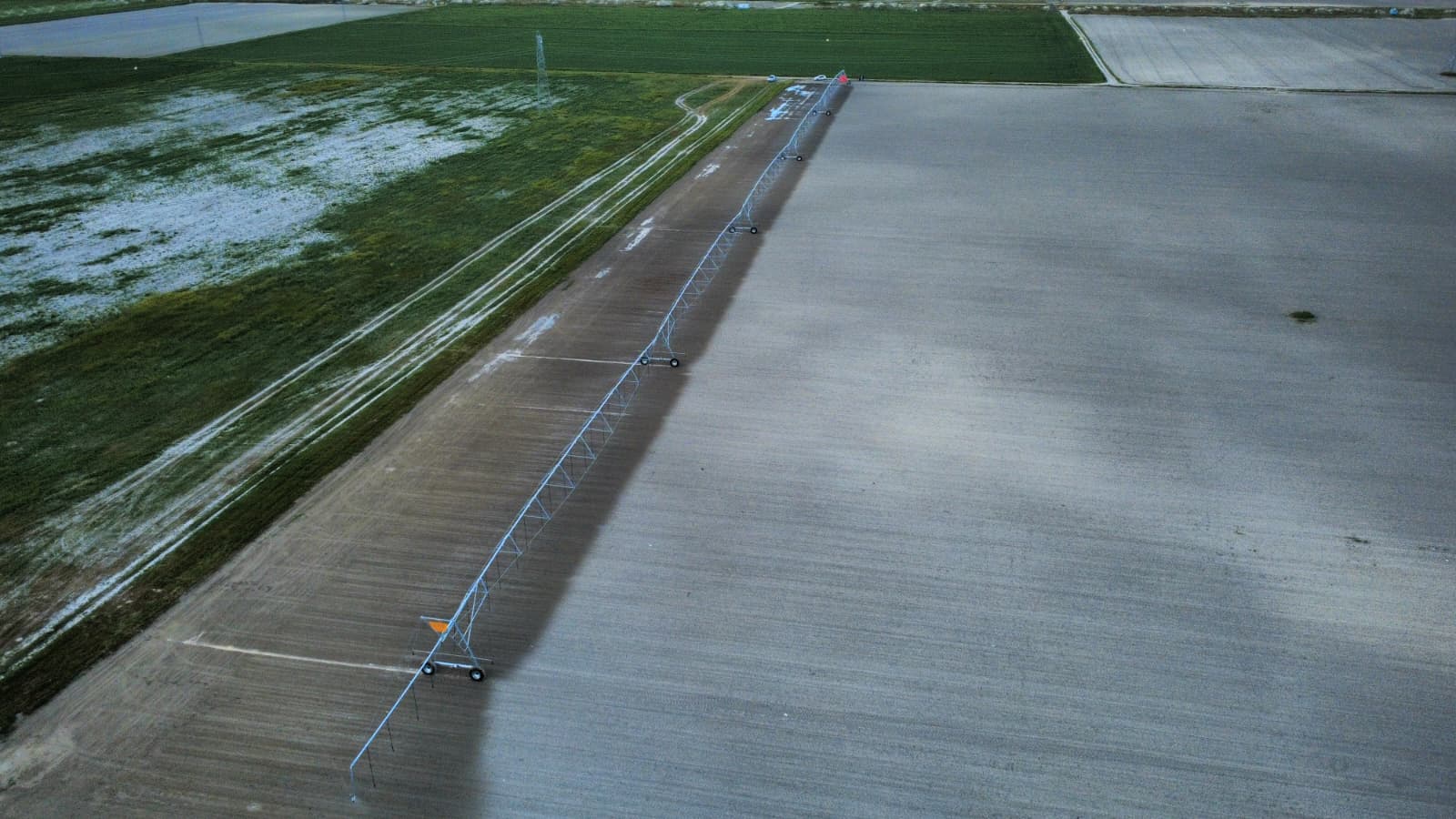 Aerial view of the linear irrigation system across the field